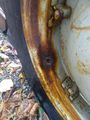1954 Ford NAA - Rusty spot the NAA rear rim where the rubber valve  stem tore from. I