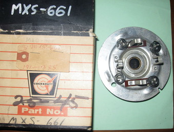Unknown Cockshutt Part. - Anyone know what this might be and what it fits on?   Looks like a starter or generator end. Part numbers on it are MXS-661, MAO-407 and maybe G-1022.    It is in a cockshutt box and came from a White dealership.