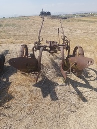 Deere - Found this in Colorado. Is this a factory  production or something cobbled together ?  John Deere 642 on the beams. Used as  tillage or something else? ....Desirable  or rare ?