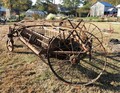 John Deere 594 Hay Rake? - I recently volunteered at a local museum (Poquoson,  VA) to research the origins of some old farm  equipment that they received as donations. The  equipment is in as is condition and may not be  complete.  Id be most appreciative of any assistance that I  can get, in regard to identifying this particular  piece of equipment; 1.	Who manufactured it? 2.	When was it manufactured? 3.	What did it cost? 4.	How was it used? 