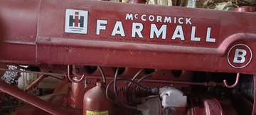 Farmall B - Hi my name is Al. I have one and not sure about  what it really is other than the name and it was  restored. I have attached a few pictures. If you  could help me with info on it I would appreciate it  and even maybe a value. I can't find another with  the 2 seats either.<P> Thank you Al<P>al@maxal.us<P>570-390-9111<P>