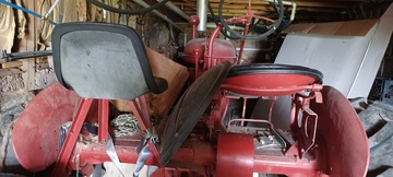 Farmall B -  I have one and not sure about what it really is  other than the name and it was restored. I have  attached a few pictures. If you could help me with  info on it I would appreciate it and even maybe a  value. I can't find another with the 2 seats  either.<P> Thank you Al<P>al@maxal.us<P>570-390-9111<P>
