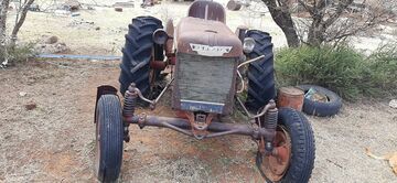Unknown - Does anyone know the model of this Farmall please.  It's got coil spring suspension on the front axle??   It's for sale on a Farm in South Africa.