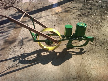John Deere Corn Drill/Planter - Un-restored, late 1800's to early 1900's.  Unsure of the exact year or model, i  have seen others called a #227 corn  drill. But was in really bad shape when  i acquired it and was missing numerous  parts, managed to get everything i was  missing and make a complete machine in  working condition, with the optional  fertilizer distributer or pea seeder.<P> Matt<P>mavery1987@yahoo.com