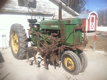 JD 2 Row Cultivator - I went to a gentleman's house to buy 5 sets of  plates for my JD 290 planter and came home with  the plates and a 2 row cultivator to mount on my  '54 model 60. It is 100% complete with mounting  hardware and the 'back scratchers' that cultivate  behind the rear tires. I'm unsure of the cultivator  model so if someone can fill me in I'd sure  appreciate it.