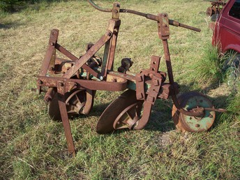Ji Case 30 Inch Double Disk Plow - plow works good including rear wheel adjustment even though the screw is bent. I have no cleaners but there are places for cleaners This is very heavy 8n s won't pull it.