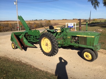 John Deere 18 Picker - Here is our John Deere 18 corn picker. My dad wanted to buy this exact picker was it was brand new and a neighbor out the other ridge actually bought it before he did. It was the last one that dealer could get for the season. About 30 years later my dad bought it at his auction sale. It has never picked much corn in its life and this is the first time it has been out of the shed in 7 or 8 years. All original. Wondering what the value of something like this is?