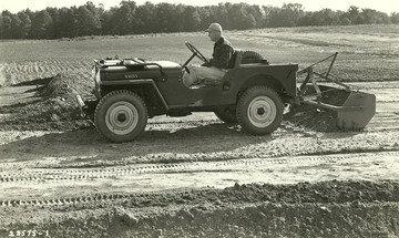 Willys 3-Pointe Hydraulic W/Woods Grade Box - This is my father, Frederick A. Stobbe, 1913-1974. He graduated Dearborn High, worked at Dearborn Inn, near Ford Rouge. Started career doing prototype work for Ford Ferguson System at the Rouge facility before WWII. Drafted US Army, served Corps of Engineers 460th France Belgium North Africa. Returned 1945 to re-establish career at Ford Tractor