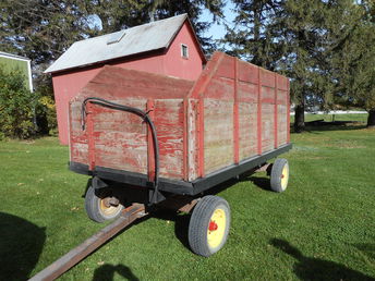 Minnesota 1262 Barge Wagon - This is my second Minnesota 1262 barge box on a 6 ton Minnesota  running gear. I bought this from a farmer just west of me late last  summer. He had put in new 4x4 cross stringers and new floor  boards. I actually visited this wagon a couple of years ago but we  could not agree on the price. Now, I am going to restore the box, but  I have not decided to paint it red or varnish the wood/paint the irons  red.