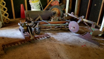 1950S Bolens Power-Ho - I have four restorable implements for a Bolens Power- HO from the 1950's.  I either need to find two 5-12  wheels (and tires) to restore the tractor, or I need  to sell these implements.  Pictured are a Reel Mower,  a Sickle Bar Mower, a Plow, and a Snow Blade.  I  would prefer to find the wheels and tires to begin  the restoration process on the Power-Ho tractor.