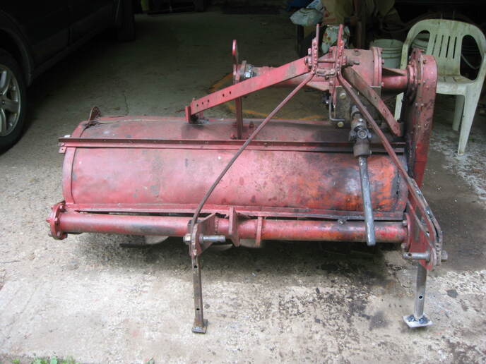 The Roteh O   Trademark By Rotary Hoes LTD, East Horndon, Essex, England - I brought this used 53 inch Roto Tiller, English  Patent Numbers, 801264, 818796, 818797, near  Bradford, Ontario, Canada in 1980 for 100 dollars,  it needed a little loving care, but after that it's  given me years of service tilling small fields that  haven't been tilled in many many long years here in  Haliburton County. Because of it's weight I don't  need to plow them before hand, all I need to do is  past one way then back again on the 1st past, then  after that over lap by 2 ft