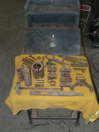 1925-1930S - My grandpa owned a Case Dealership and a 1929 Case L Tractor.  I believe this tool box is mostly for a sleeve puller and the wrench is to remove the hubcap/bearing cover.
