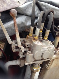 1962 Ford Tractor - My tractor is a 1962 Ford Tractor but I am pretty sure  the hydraulics were probably added afterwards.  Can  anyone help me Id what the hydraulic controls are. The  only marking is ; 2737