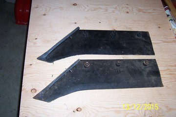 Dearborn Plow - Brand new shares - never mounted; black paint still on them. These fit the 2 bottom 14' Dearborn plow. Bolts/nuts included.<P>The number stamped on the back is; 100003FT SOLID.<P>