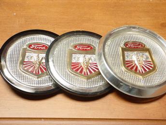 1958-1961 Ford X01 Series - Front Emblem - Ok, the one on the right is an original,correct for the 801, 501, and 901 series. The one in the center is original, correct for 601, 701 series. The one on the left is the new one available as replacement. Replacement is all plastic, the originals were glued to metal backings. Failure of the glue results in the rarity of originals.