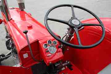 1959 Massey # 98 - Recon; Steering Wheel - Nice pic of a fully recondition steering wheel on Massey #98, also a full hood view from the drivers seat. It's nice to maintain the original 4 spoke wheel.