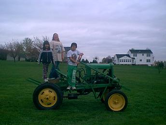 1928 Model A Ford And More Monkey Tractor - Here is my daughter and her friends on my Monkey Tractor. I would like to hear from anyone else who has a Homemade Tractor. E-Mail me at dceent@hotmail.com