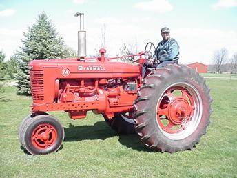 1950 Farmall M (After) - This tractor was saved from a fence row in MI and restored by the owner.
