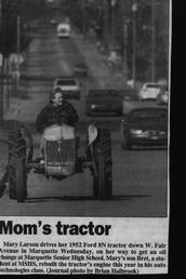 1952 Ford 8N - Picture of Mary Larson from Marquette, Mi. driving her 52, Ford 8N tractor for an Oil change at Marquette High School where her son Bret rebuilt it as a class project.