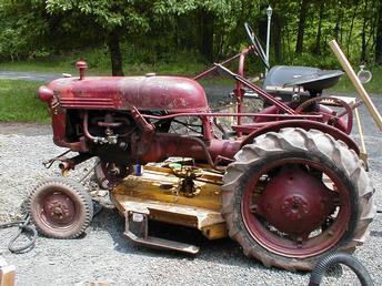 1948 Farmall FCUB - Uncle purchased it as a one owner in 1957. I just inherited it when he passed away. It's been used every week as a field and brush mower. I currently use it now. Still has the mower deck attached to it and in the barn it the original snow plow.