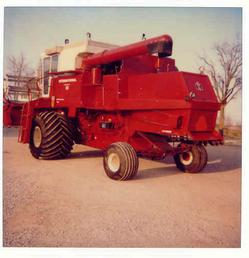 1976 815 International Combine - This is my Dad's 76 model 815 combine equipped with 66 by 43 by 25 Goodyear Terra Tires. The combine was a corn and soybean special, had the 414 diesel engine and a 15 ft platform with an 863 6 row cornhead. He bought this machine new, wheat hrvest of 76 after our 69 815 was destroyed by fire. This machine was 6 years old in this photo, taken 1982.