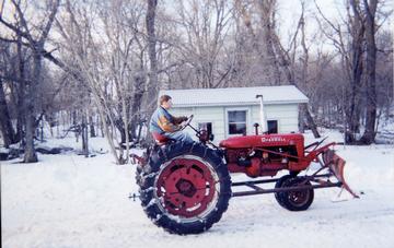 1950 Farmall C - Here it is so far. Needed to put it back togeather last winter because of the snow, but now I have the Farmall M with the John Deere 45 loader on it, so there won't be an obstacle like SNOW this time!
