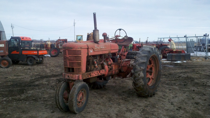 1946 Farmall M - My 1946 Farmall M that I just bought.. in this photo its at the salvage yard waiting to be taken to its new home. ;) This tractor runs and drives great
