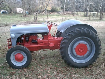 1944 Ford 2N - This one is from the ranch next door. They brought it out for me to freshen up. It's been retired for years. I like bringing them back to work.The whole tractor was rebuilt a few years before it retired. I cleaned, adjusted, rewired and painted. I know it's the wrong color, but he wanted it painted the way his father had it done years ago.They're going to use it to pull a sprayer and other light work.