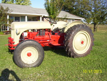 1950 8N Ford - This is my 1950 8N Ford tractor that a  very good friend and I stripped and  repainted.  It took almost a year to  finish.  I still need to paint the ford on  each fender and each side of the hood.  I  hope you enjoy the pictures.