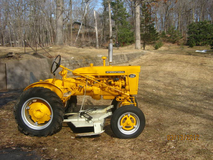 1962 International 140 Industrial - Unusual International 140 Industrial  version of the Farmall 140. This tractor  used to mow the ditches in Kane County,  IL when I was kid - check Photo Ads for  more details.