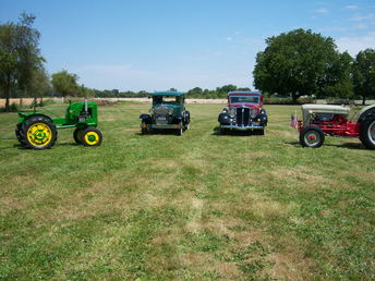 1941 John Deer L.A And 1956 Ford 600 Series. - The tractors were being cleaned up for  last years July 4th parade at  Harrisburg,Or