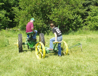 1923 John Deere #1 Mower - Pulled by 1943 John Deere H. We still make hay for our pony. The mower works great. The Amish in our area still keep the parts. Daughter Katy has to lift the cutterbar for me.