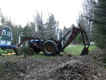 1954 Ford 850 -  Bought in 2010 from a friend of mine. Story that came with the tractor is it was originally a Vermont Highway Department piece. Pippin backhoe, bucket on front accepts a Fisher plow, angles using the dump cylinder. Plows/piles snow great once you get used to steering with the brake pedals.