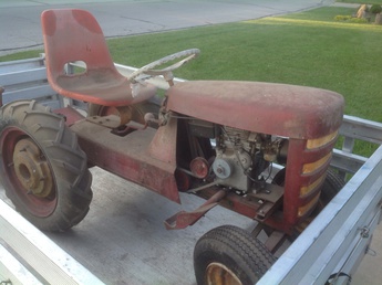 Unknown - Can anyone help me with what year and make  this tractor is? It has no markings and the motor  and seat are not original.