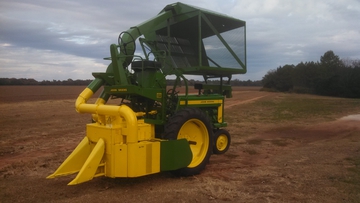 JD 420 T With A #12 Cotton Picker  - This set up came out of north Alabama. Story goes that the original owner had the local dealer put the picker on it in '56 and he picked 20 acres of cotton up until 2006. Recently restored and yes, she still can pick cotton too. She resides in middle Georgia now.