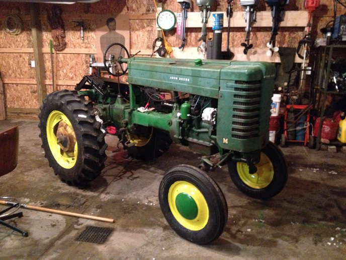 1948 John Deere M  - Took me 4 years but I'm on the home stretch  needs the fuel tank lined and the front axle pin  fixed and paint everything has been rebuilt