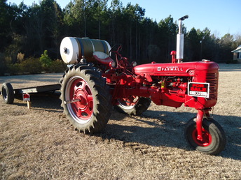 1949 Mccormick Farmall C Full.Rest. - 1949 McCormick Farmall C.Fully restored to 6 V,fresh paint, Pulley,owners manual.60 gal.spray tank w/60 ft. hose incl.very clean Call 910-977-3491