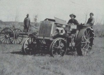 1919 Beaver - The picture was taken on our land in 1919 and the tractor was brand new in the pic. To my knowledge Beaver tractors were manufactured in Brampton, Ont. and discontinued years later.  I'd like to know if the one in the picture is the bigger or smaller model since there were two sizes. Someday (although that's asking for a lot) I'd Love to own one of these tractors.
