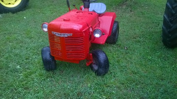 Home Made - took old rusty hood and grill from 1940? A  and grafted it on Craftsman mower for my  grandson, hes the hit of the tractor show,  hes three years old.