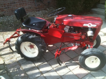 1961 Wheel Horse 701 -  My 1961 Wheel Horse 701 with two piece cultivator set and Hein-Werner hydraulic lift pump.