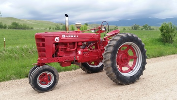 1954 Farmall Super M - The newest addition to my collection.   A restored 1954 Farmall Super M thats  set up for tractor pulling.  It dynos  at 50 horse!  I bought it at auction  for 2800.  I love it!