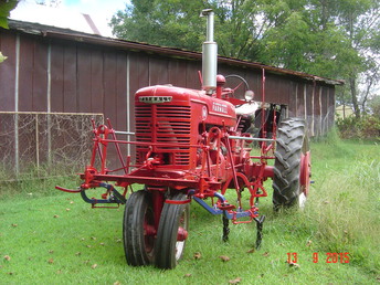 1945 Farmall M W/ HM221 Cultivator - Got the cultivators about a year ago (thanks Plow Peddler). Had to make gathering bars and replace pushrods, but everything else was there. I can understand why they went to hydraulics instead of handlift!!!! Was going to mount for show on my H, but would have had to swap rear wheels around (too much work just for show!!!), besides, it's unusual to see them on an M.