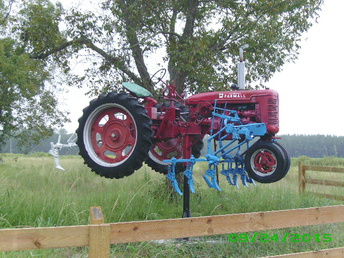 Super C Farmall - Saw this on Hy 23 South of Hazlehurst,Ga.  Appears to be fully intact, on display for all  to enjoy.