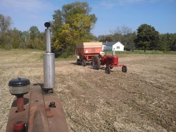 1953 Farmall Super C - Pulling the rye seed wagon. Picture taken from my 450D.