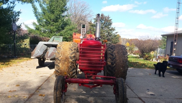 1948 Farmall M - Tried picking corn today.clay ground was  a little sticky.made the duals into one  big tire.