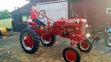1950 Farmall Cub - This is a 1950 Farmall cub fully restored, it is serial # 103222, it was delivered to the dealer white with red trim as a demonstrator model, then Repaint Red with silver trim when sold to a customer, the tractor has been in our family for 27 years
