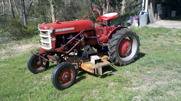 1963 Farmall Cub - I repainted this back in the 90's. Has  the second mower deck which is a 59'  Woods.