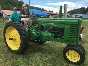 1943 John Deere Model A - My wife and I bought this one at a show that we  attended with our son while he was showing his  restored 1975 PowerKing. We fell in love with it and  the price was right. We plan on taking it to shows  and other events just to enjoy driving it, showing  it and talking to other enthusiasts.