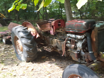 Massey Ferguson  - Don't know much about the tractor other than  it's a Massey Ferguson tractor? Starting  asking price is 2,000.00.
