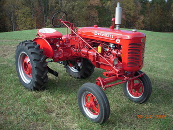 1953 Farmall Super A - This one spent many years on a NC tobacco farm.  Now  use it to mow the back lawn.  Still runs great.